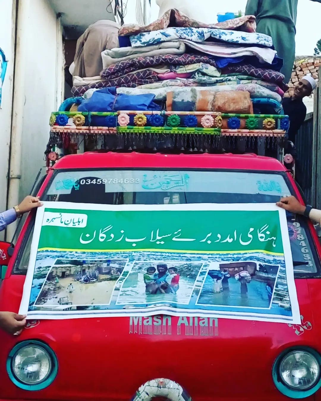 A pickup loaded with blankets and bedding leaving for the 2022 flood victims
