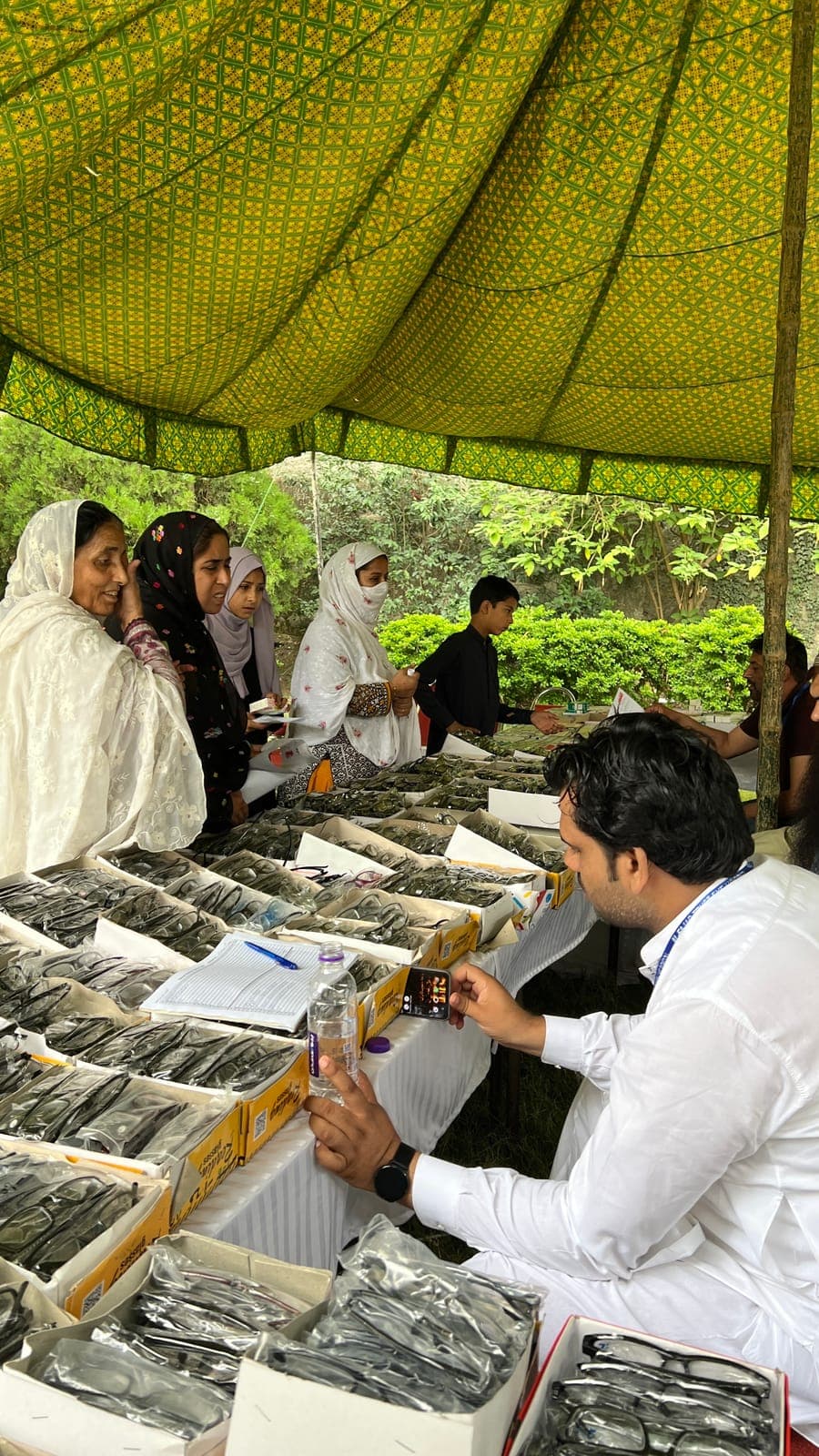 Women choosing their free spectacles at the June 2025 eye camp