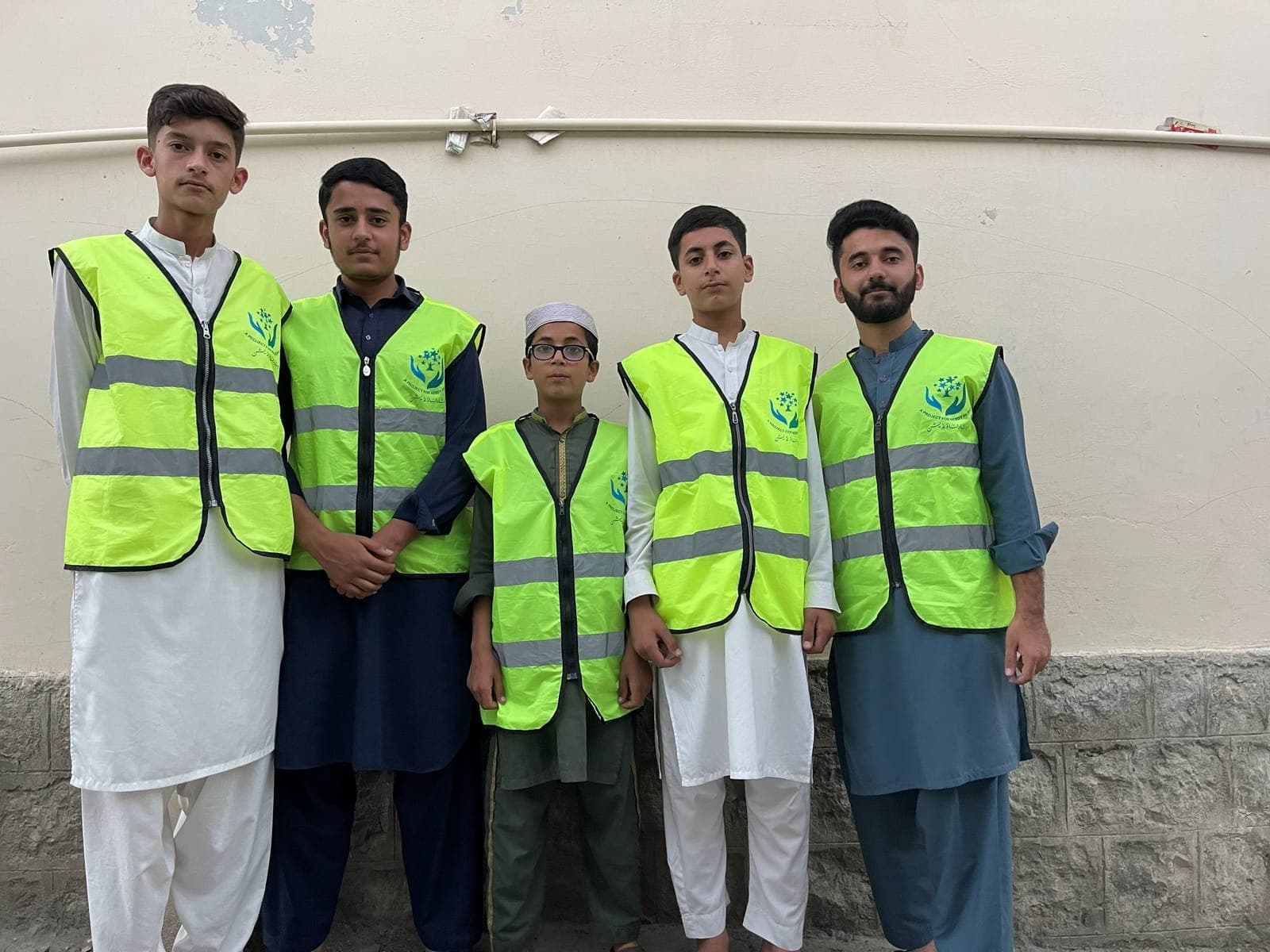 Karwan-e-Eesaar volunteers in their vests before a drive